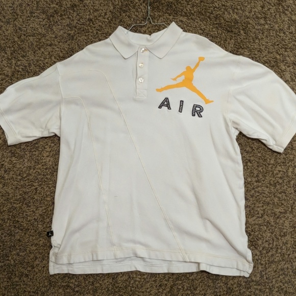 white and gold jordan shirt